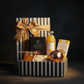 The Feel Better Box - 1in99 Gifts signature black and white hamper with gold ribbon