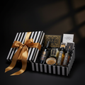 The Anniversary Celebration Hamper - 1in99 Gifts signature black and white hamper with gold ribbon